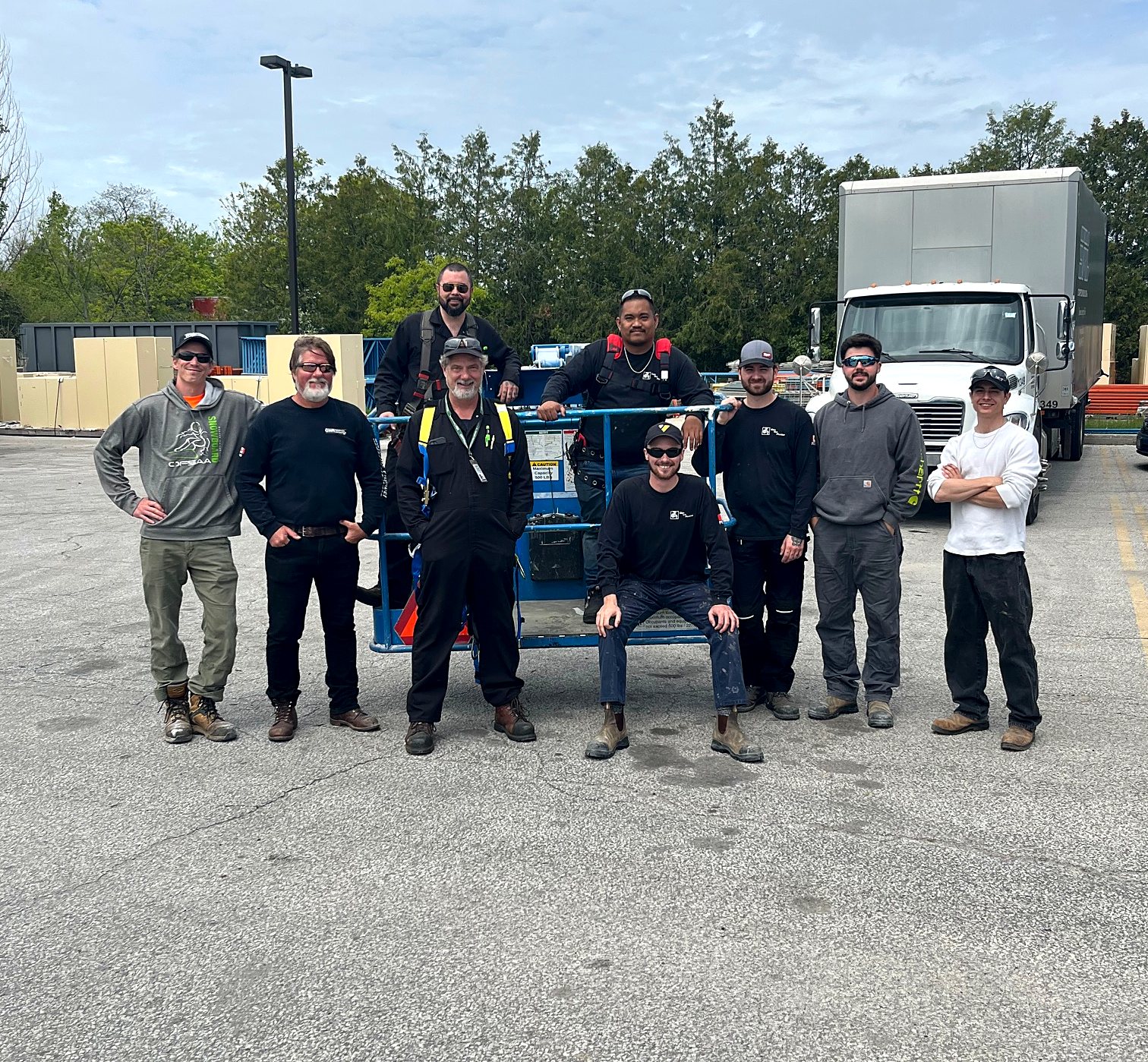 The Glen The Plumber crew together on a job site with their service truck